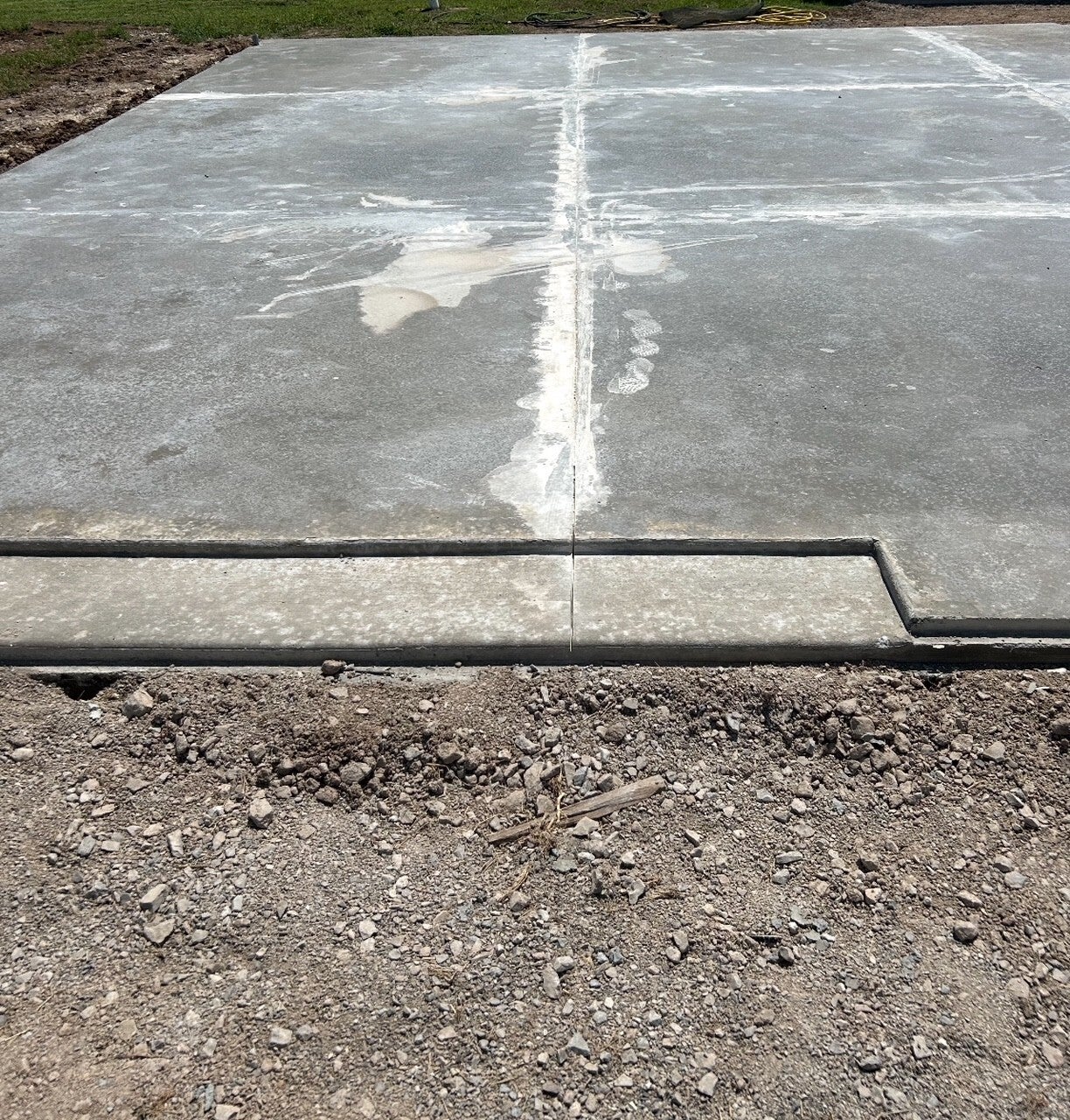 Concrete garage door opening with an inset and a raised lip detail