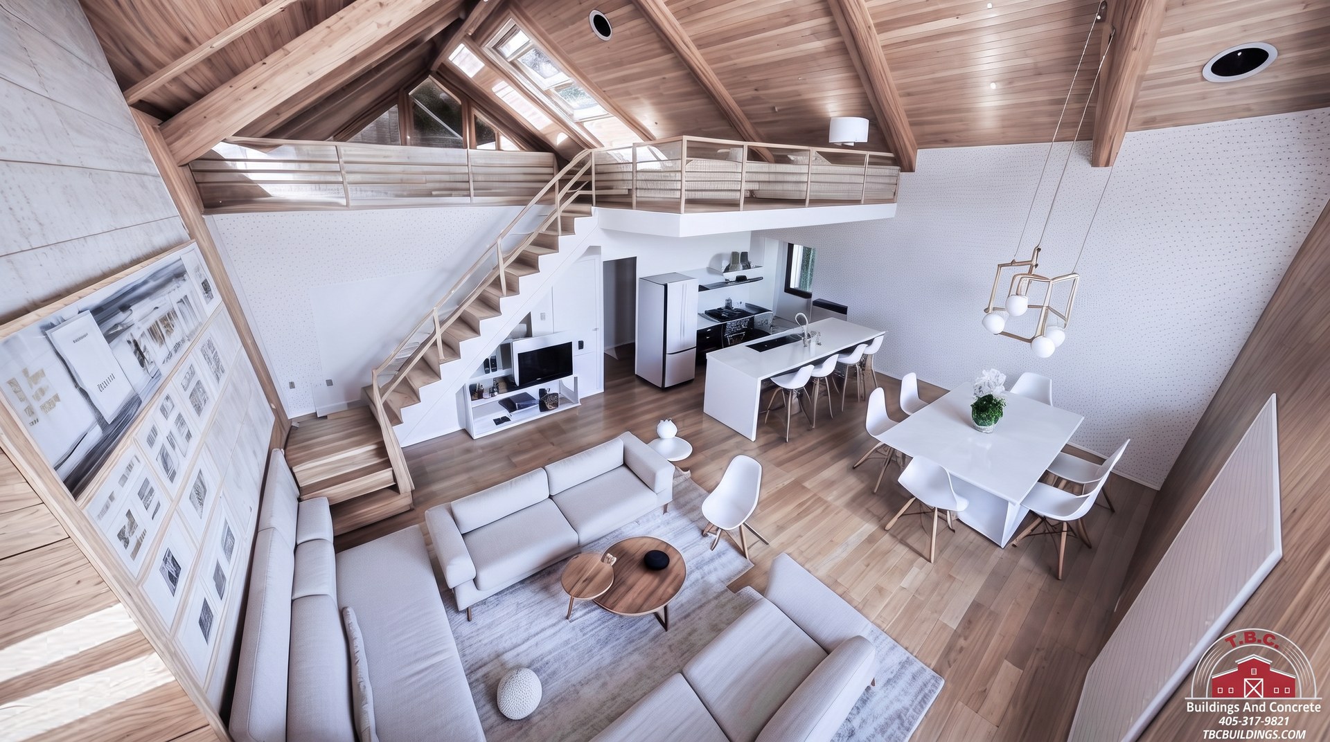 TBC project photo of a high-angle finished great room with seating, dining area, staircase, and wood ceiling.